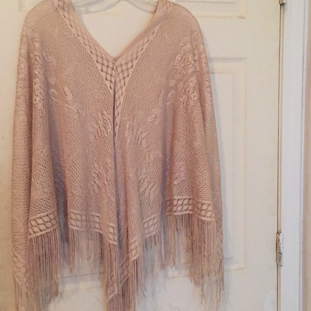 A golden Shaw/poncho.